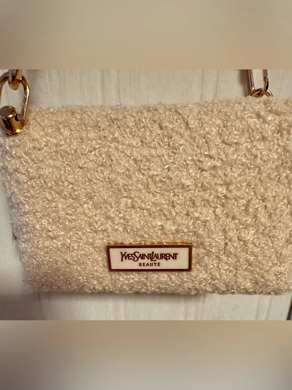 Yves Saint Laurent beaute Cream shearling pouch with gold hardware